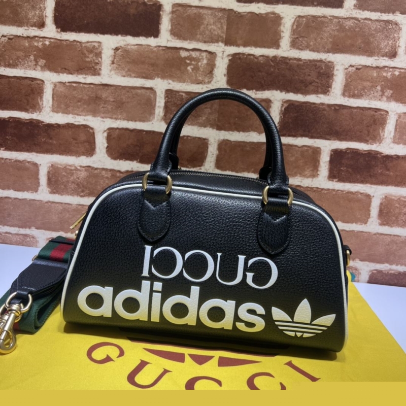 G*u*i top handle bags
